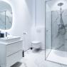 Modern bathroom with shower, toilet and washbasin.