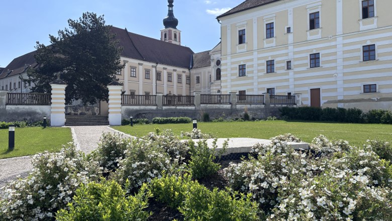 Geras Abbey with garden and flowers in the foreground.